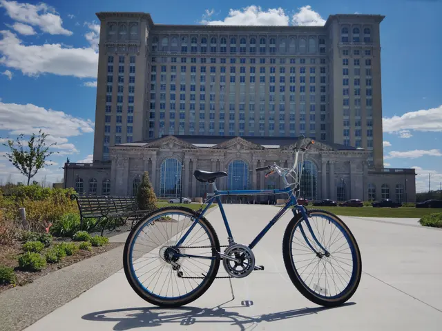 Blue bicycle photographed in a sunny plaza