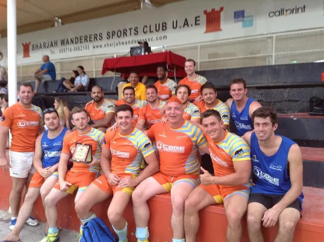 Friends and teammates together in orange shirts