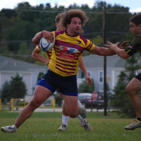 Yellow and red player passing the ball